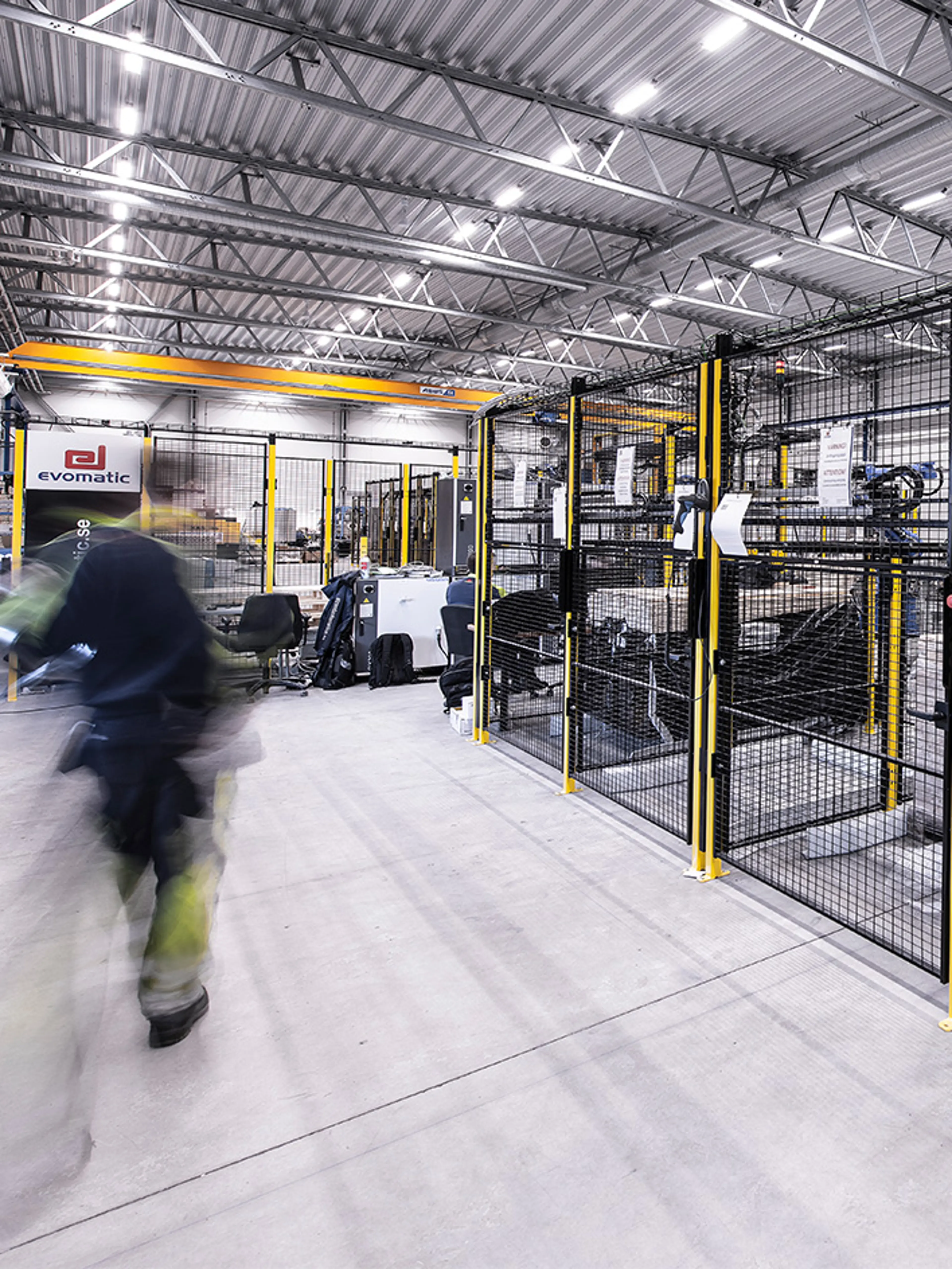 Stationary automated storage and packaging machines, including conveyors, sorters, and palletizers in a warehouse setting