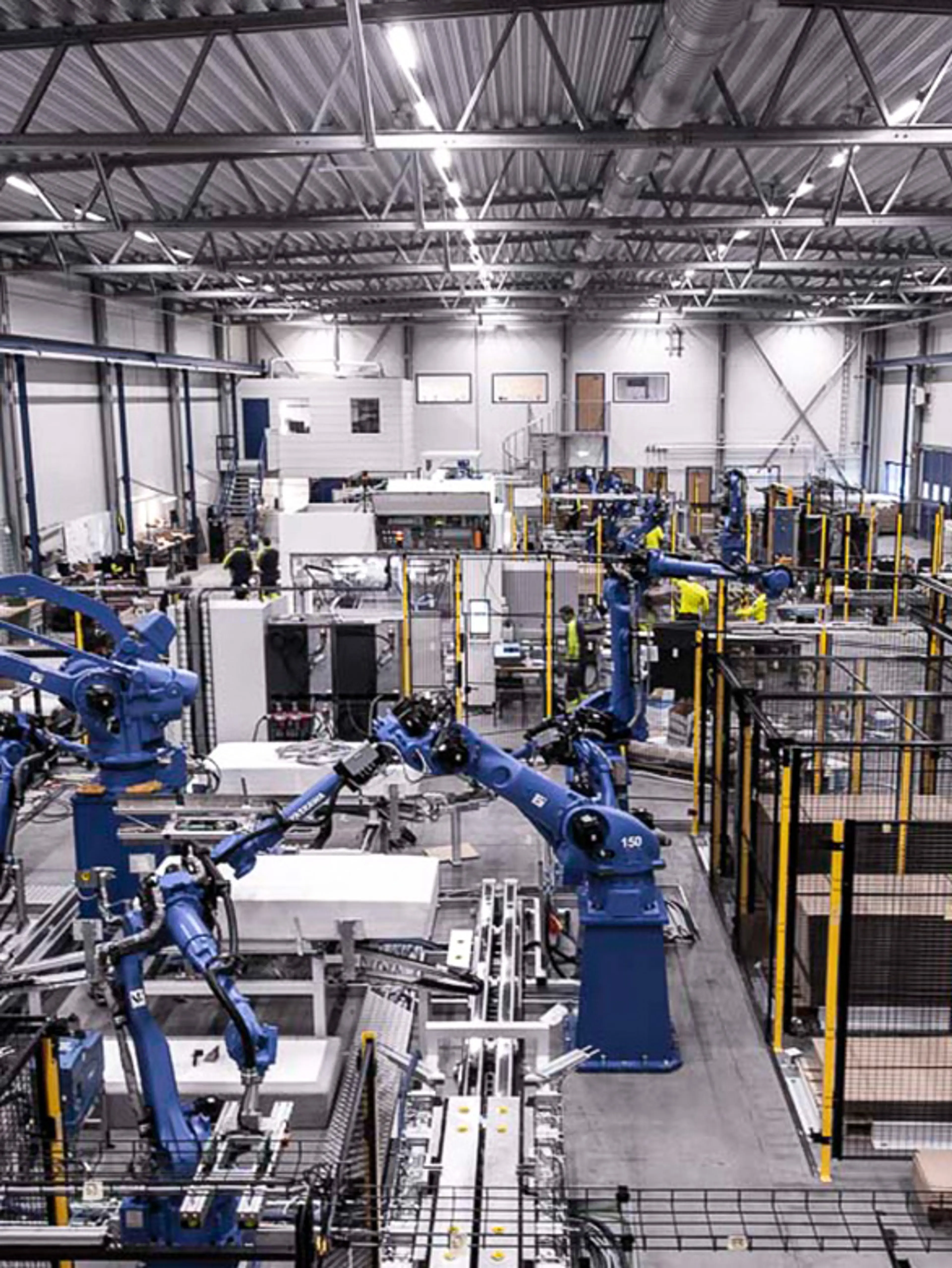 Fixed automation machinery with guarded entry and exit points to reduce risks from moving goods